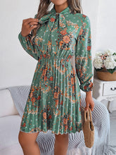 Load image into Gallery viewer, Pleated Printed Tie Neck Long Sleeve Dress