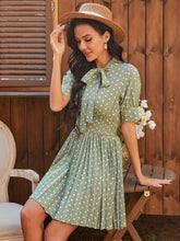 Load image into Gallery viewer, Polka Dot Pleated Tie Neck Smocked Waist Dress